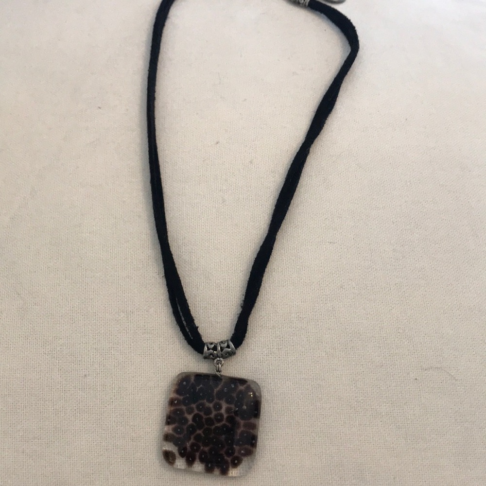 Black necklace with leopard medallion